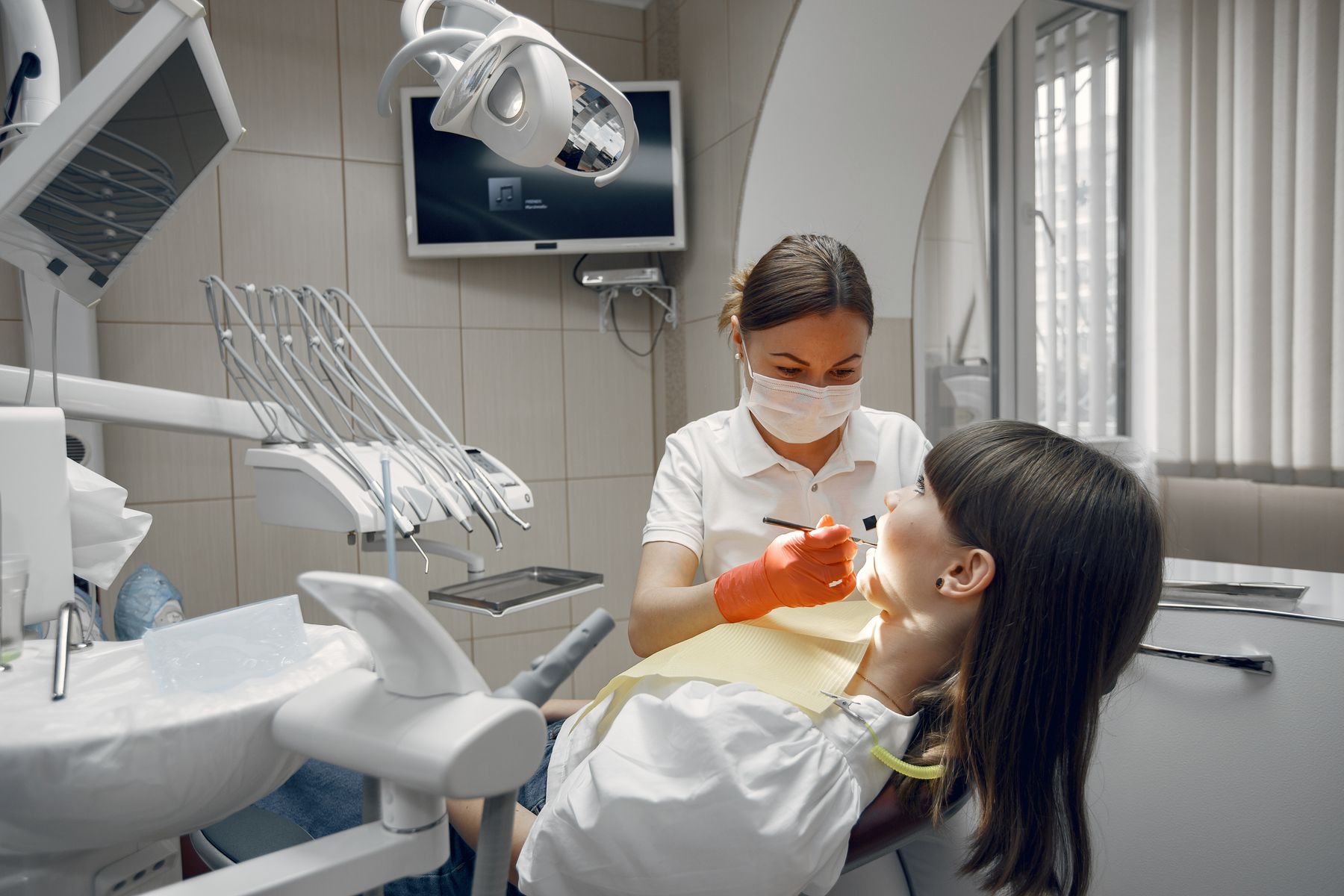 Dentist examining a patient in a modern clinic