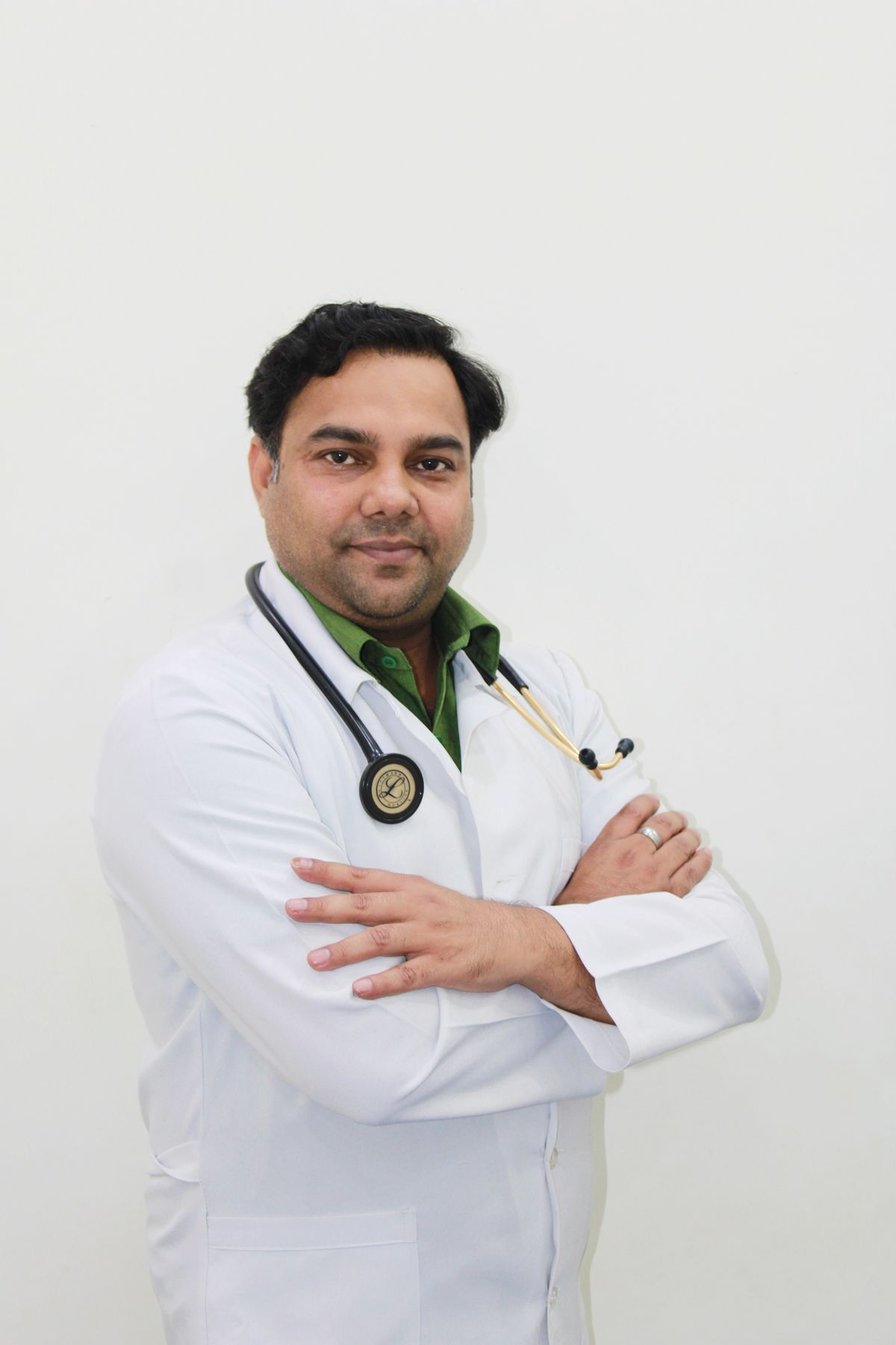 Stock male clinician portrait used for Dr. Samir Al Harthy, a fictional sample profile