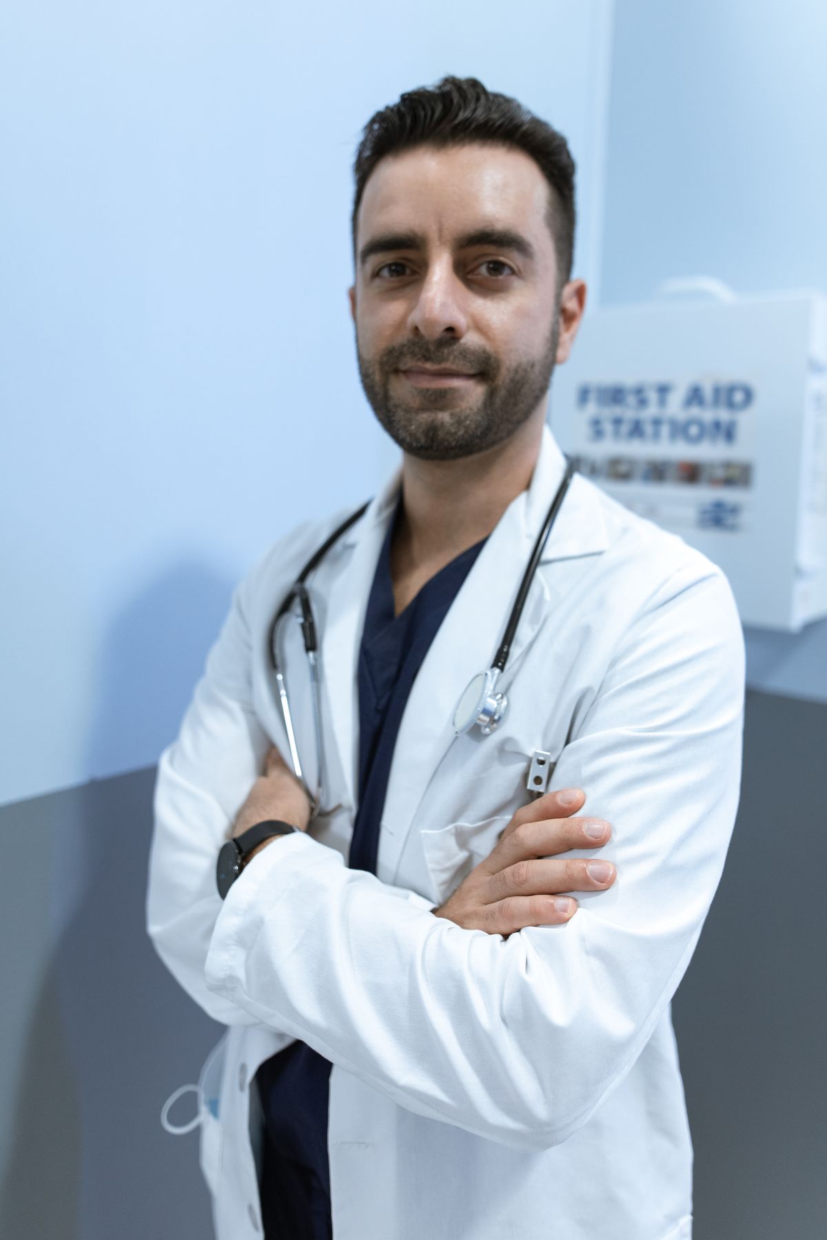 Stock male clinician portrait used for Dr. Kareem Nasser, a fictional sample profile