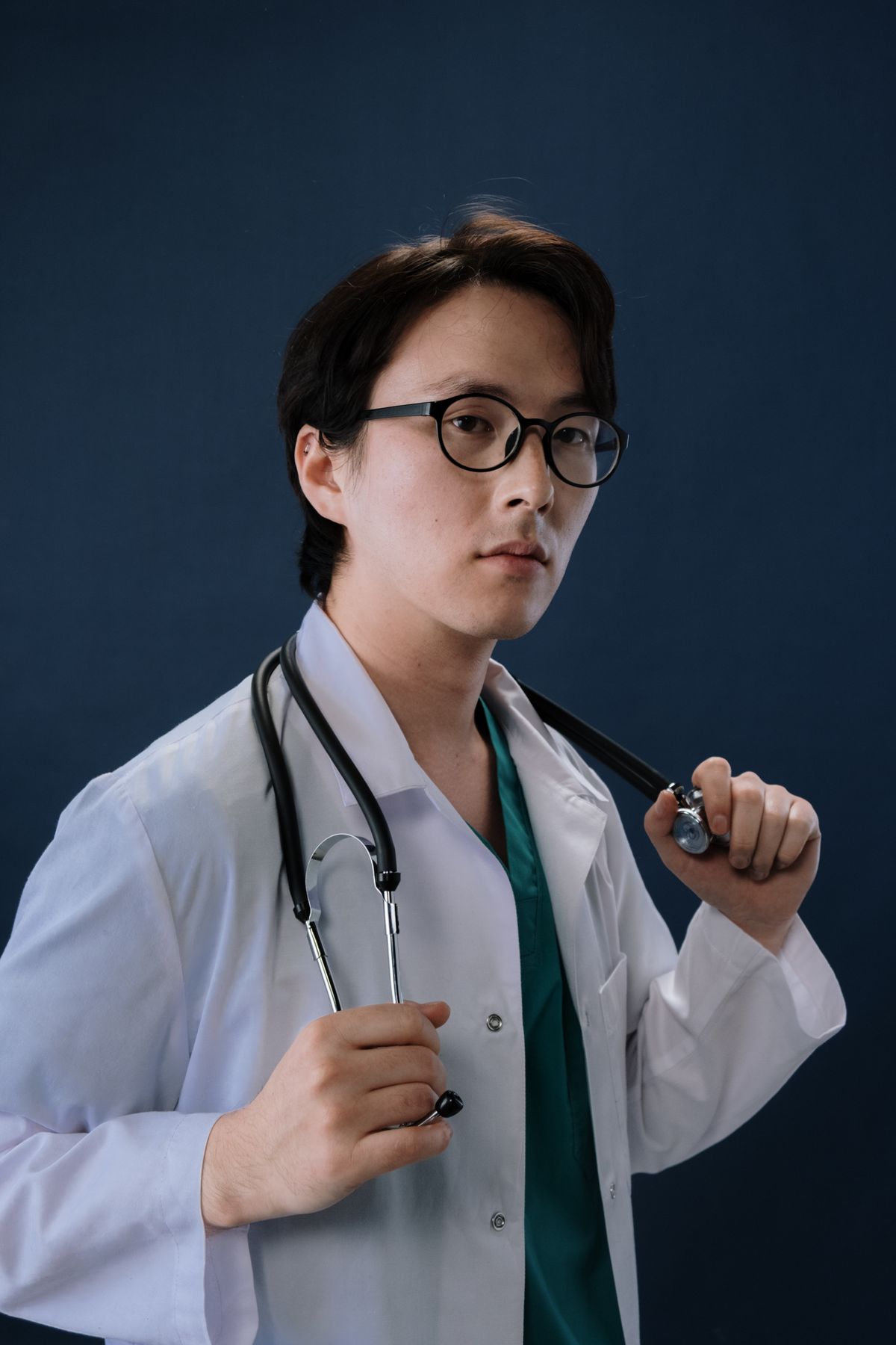Stock male clinician portrait used for Dr. Omar Yusuf, a fictional sample profile